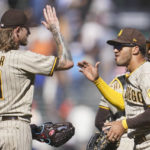 
              San Diego Padres' Josh Hader (71) celebrates with Trent Grisham, second from right, and Jurickson Profar after the Padres defeated the San Francisco Giants in a baseball game in San Francisco, Wednesday, Aug. 31, 2022. (AP Photo/Jeff Chiu)
            