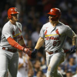 
              St. Louis Cardinals' Tyler O'Neill (27) celebrates with teammate Nolan Gorman, left, after hitting a two-run home run during the fourth inning of the second game of a baseball doubleheader against the Chicago Cubs Tuesday, Aug. 23, 2022, in Chicago. (AP Photo/Paul Beaty)
            