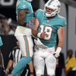 
              Miami Dolphins wide receiver Lynn Bowden Jr. (3) celebrates with quarterback Skylar Thompson (19) after scoring against the Tampa Bay Buccaneers during the first half of an NFL preseason football game Saturday, Aug. 13, 2022, in Tampa, Fla. (AP Photo/Jason Behnken)
            