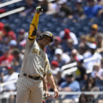 
              San Diego Padres' Juan Soto gestures after he singled during the third inning of a baseball game against the Washington Nationals, Sunday, Aug. 14, 2022, in Washington. (AP Photo/Nick Wass)
            