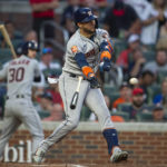 
              Houston Astros Yuli Gurriel swings and loses his bat in the third inning of a baseball game against the Atlanta Braves Saturday, Aug. 20, 2022, in Atlanta. (AP Photo/Hakim Wright Sr.)
            