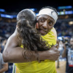 
              Minnesota Lynx center Sylvia Fowler, rear, hugs Seattle Storm guard Sue Bird (10) after a WNBA basketball game Friday, Aug. 12, 2022, in Minneapolis. (Elizabeth Flores/Star Tribune via AP)
            