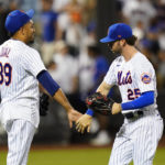 
              New York Mets relief pitcher Edwin Diaz (39) celebrates with Tyler Naquin (25) after the team's 6-4 win in a baseball game against the Atlanta Braves on Thursday, Aug. 4, 2022, in New York. (AP Photo/Frank Franklin II)
            