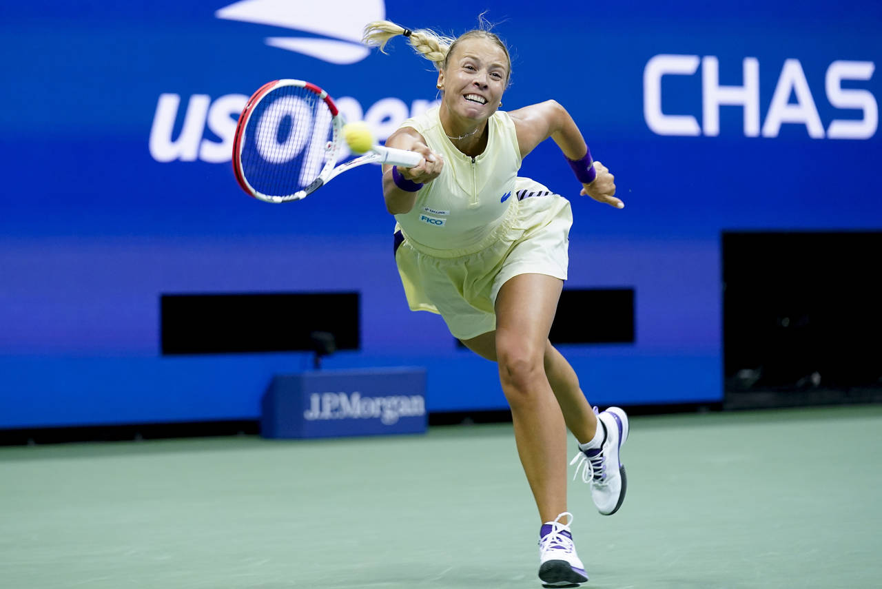 Anett Kontaveit, of Estonia, returns a shot to Serena Williams, of the United States, during the se...