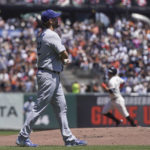 
              Los Angeles Dodgers pitcher Clayton Kershaw, foreground, reacts as San Francisco Giants' J.D. Davis, rear, rounds the bases after hitting a two-run home run during the second inning of a baseball game in San Francisco, Thursday, Aug. 4, 2022. (AP Photo/Jeff Chiu)
            