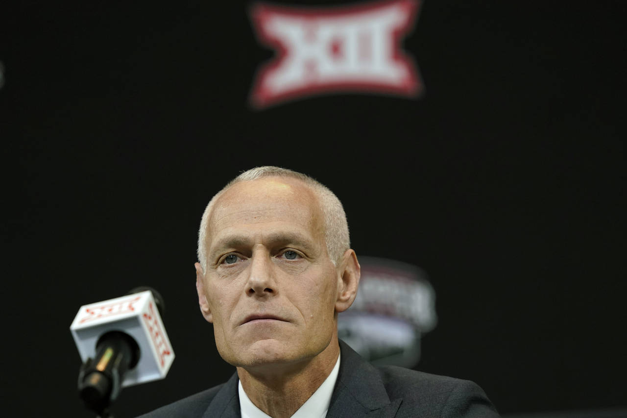 FILE - Incoming Big 12 Commissioner Brett Yormark listens during a news conference opening the NCAA...