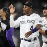 
              Colorado Rockies' Elehuris Montero is congratulated by teammates after the team's baseball game against the San Francisco Giants on Friday, Aug.19, 2022, in Denver. Montero hit two home runs in the game. (AP Photo/David Zalubowski)
            