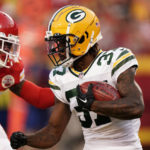 
              Green Bay Packers cornerback Rico Gafford (37) runs with the ball as Kansas City Chiefs safety Deon Bush (26) defends during the first half of an NFL preseason football game Thursday, Aug. 25, 2022, in Kansas City, Mo. (AP Photo/Charlie Riedel)
            