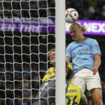 
              Manchester City's Erling Haaland scores his side's third goal during the English Premier League soccer match between Manchester City and Nottingham Forest at Etihad Stadium in Manchester, England, Wednesday, Aug 31, 2022. (AP Photo/Dave Thompson)
            