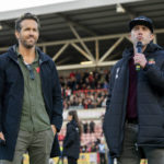 
              This image released by FX shows Ryan Reynolds, left, and Rob McElhenney in a scene from the docuseries "Welcome to Wrexham," which follows Reynolds and McElhenney as they takeover the lower-league Welsh soccer team Wrexham AFC. (Patrick McElhenney/FX via AP)
            