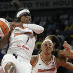 
              Phoenix Mercury guard Diamond DeShields (1) grabs a rebound against the Las Vegas Aces during the first half in Game 1 of a WNBA basketball first-round playoff series Wednesday, Aug. 17, 2022, in Las Vegas. (AP Photo/John Locher)
            