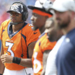 
              Denver Broncos quarterback Russell Wilson watches from the sidelines during the second half of a preseason NFL football game against the Buffalo Bills, Saturday, Aug. 20, 2022, in Orchard Park, N.Y. (AP Photo/Joshua Bessex)
            