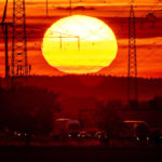 
              The sun rises above a highway in Frankfurt, Germany, Tuesday, Aug. 2, 2022. (AP Photo/Michael Probst)
            
