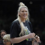 
              Former Seattle Storm center Lauren Jackson stands courtside before a WNBA basketball game between the Storm and the Minnesota Lynx, Wednesday, Aug. 3, 2022, in Seattle. Jackson attended the game in honor of the final season of Storm guard Sue Bird. (AP Photo/Ted S. Warren)
            