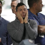 
              Rory McIlroy, of Northern Ireland, center, listens to PGA Tour Commissioner Jay Monahan during a press conference at East Lake Golf Club prior to the start of the Tour Championship golf tournament Wednesday Aug 24, 2022, in Atlanta, Ga. (AP Photo/Steve Helber)
            