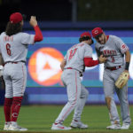 
              Cincinnati Reds second baseman Jonathan India (6) shortstop Kyle Farmer (17) and right fielder Albert Almora Jr. (3) celebrate after the Reds beat the Miami Marlins 3-1 during a baseball game, Monday, Aug. 1, 2022, in Miami. (AP Photo/Wilfredo Lee)
            