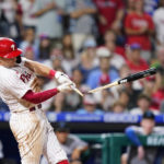 
              Philadelphia Phillies' Rhys Hoskins breaks his bat hitting into a double play during the eighth inning of a baseball game against the Miami Marlins, Wednesday, Aug. 10, 2022, in Philadelphia. (AP Photo/Matt Slocum)
            