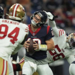 
              Houston Texans quarterback Davis Mills (10) is pressured by San Francisco 49ers defensive end Samson Ebukam (56) during the first half of an NFL football game Thursday, Aug. 25, 2022, in Houston. (AP Photo/Eric Christian Smith)
            