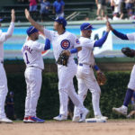 
              The Chicago Cubs celebrate the team's 4-0 win over the Miami Marlins after a baseball game Saturday, Aug. 6, 2022, in Chicago. (AP Photo/Charles Rex Arbogast)
            