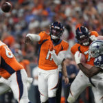 
              Denver Broncos quarterback Josh Johnson (11) throws against the Dallas Cowboys during the first half of an NFL preseason football game, Saturday, Aug. 13, 2022, in Denver. (AP Photo/David Zalubowski)
            