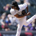 
              Colorado Rockies starting pitcher Jose Urena works against the Texas Rangers in the first inning of a baseball game Wednesday, Aug. 24, 2022, in Denver. (AP Photo/David Zalubowski)
            