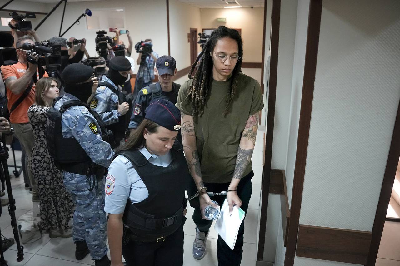 WNBA star and two-time Olympic gold medalist Brittney Griner is escorted in a court prior to a hear...