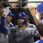 
              Kansas City Royals' Whit Merrifield celebrate in the dugout his home run off Chicago White Sox starting pitcher Michael Kopech during the sixth inning of a baseball game Monday, Aug. 1, 2022, in Chicago. (AP Photo/Charles Rex Arbogast)
            