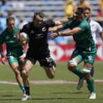 
              New Zealand's Kurt Baker, left, fends off the challenge of Irelands Harry McNulty during their Los Angeles rugby sevens series quarterfinal match at Dignity Health Sports Park in Carson, Calif., Sunday, 28, Aug. 27, 2022. (AP Photo/Marcio Jose Sanchez)
            