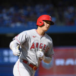 
              Los Angeles Angels designated hitter Shohei Ohtani (17) rounds the bases after hitting a two-run home run during the seventh inning of a baseball game against the Toronto Blue Jays, in Toronto, Sunday, Aug. 28, 2022. (Christopher Katsarov/The Canadian Press via AP)
            
