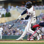 
              Minnesota Twins' Nick Gordon hits a two-run double during the first inning of the team's baseball game against the Boston Red Sox, Tuesday, Aug. 30, 2022, in Minneapolis. (AP Photo/Abbie Parr)
            