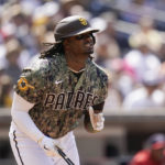
              San Diego Padres' Josh Bell watches his two-run home run hit during the sixth inning of a baseball game against the Washington Nationals, Sunday, Aug. 21, 2022, in San Diego. (AP Photo/Gregory Bull)
            