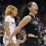 
              Seattle Storm guard Sue Bird, right, and Washington Mystics center Shakira Austin, left, react at the end of a WNBA basketball playoff game, Sunday, Aug. 21, 2022, in Seattle. (AP Photo/Ted S. Warren)
            