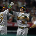 
              Oakland Athletics' Sean Murphy (12) celebrates his two-run home run with Elvis Andrus (17) during the sixth inning of the team's baseball game against the Los Angeles Angels on Wednesday, Aug. 3, 2022, in Anaheim, Calif. (AP Photo/Marcio Jose Sanchez)
            