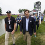 
              Tucker Carlson, front right, walks with LIV CEO Greg Norman, left, during the final round of the Bedminster Invitational LIV Golf tournament in Bedminster, N.J., Sunday, July 31, 2022. (AP Photo/Seth Wenig)
            