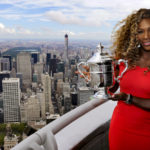 
              FILE - Serena Williams holds the U.S. Open tennis women's singles championship trophy during a visit to the 103rd floor of the Empire State Building, Monday, Sept. 8, 2014, in New York. After nearly three decades in the public eye, few can match Serena Williams' array of accomplishments, medals and awards. Through it all, the 23-time Grand Slam title winner hasn't let the public forget that she's a Black American woman who embraces her responsibility as a beacon for her people. (AP Photo/Charles Krupa, File)
            
