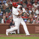 
              St. Louis Cardinals' Albert Pujols hits a single in the fourth inning of a baseball game against the Atlanta Braves on Friday, Aug. 26, 2022, in St. Louis. (AP Photo/Joe Puetz)
            