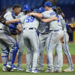 
              Members of the Kansas City Royals celebrate their win over the Tampa Bay Rays during a baseball game Friday, Aug. 19, 2022, in St. Petersburg, Fla. (AP Photo/Chris O'Meara)
            