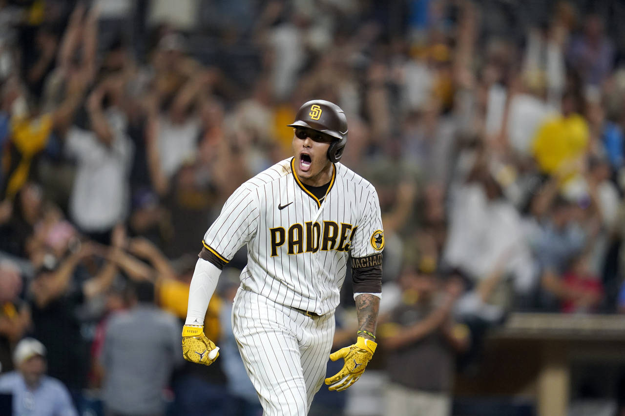 San Diego Padres' Manny Machado reacts after hitting a game-ending, three-run home run against the ...