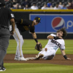 
              Arizona Diamondbacks' Jake McCarthy (30) looks to umpire Erich Bacchus after stealing second base under the tag by Pittsburgh Pirates second baseman Kevin Newman during the third inning of a baseball game Tuesday, Aug. 9, 2022, in Phoenix. (AP Photo/Rick Scuteri)
            