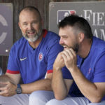 
              Chicago Cubs manager David Ross, left, talks with Wade Miley, right, before a baseball game against the Cincinnati Reds at the Field of Dreams movie site, Thursday, Aug. 11, 2022, in Dyersville, Iowa. (AP Photo/Charlie Neibergall)
            