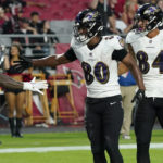 
              Baltimore Ravens tight end Isaiah Likely (80) celebrates his touchdown with teammates during the first half of an NFL preseason football game against the Arizona Cardinals, Sunday, Aug. 21, 2022, in Glendale, Ariz. (AP Photo/Darryl Webb)
            
