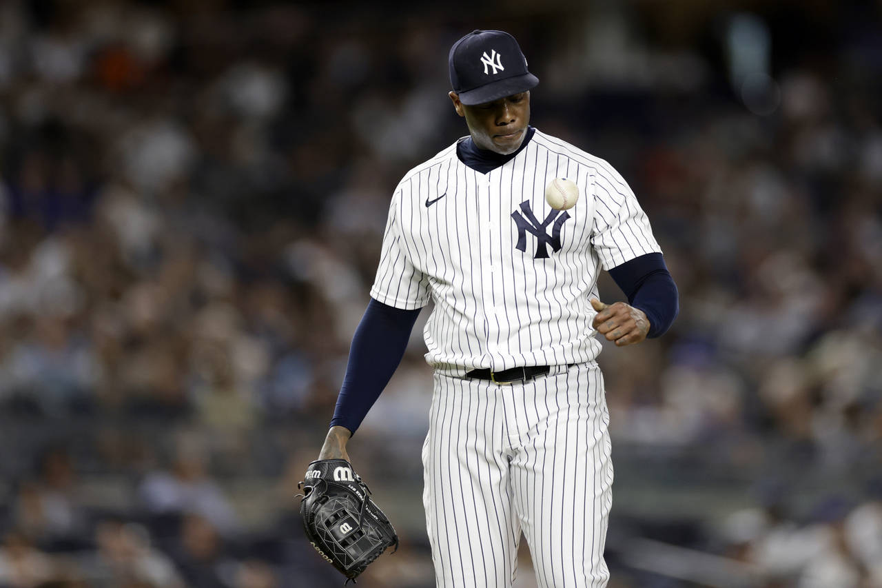 New York Yankees pitcher Aroldis Chapman reacts while he waits to be taken out during the ninth inn...