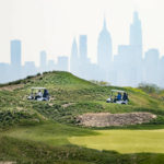 
              FILE - Patrons play the links as the Manhattan skyline is visible in the distance, at Trump Golf Links at Ferry Point in the Bronx borough of New York, May 4, 2021. The New York City-owned golf course, which is managed by former President Donald Trump's business, is expected to host a Saudi Arabia-supported women's tournament in October, city officials said Friday, Aug. 26, 2022. (AP Photo/John Minchillo, File)
            
