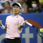 
              Yoshihito Nishioka, of Japan, hits a return to Andrey Rublev, of Russia, during a semifinal at the Citi Open tennis tournament Saturday, Aug. 6, 2022, in Washington. (AP Photo/Nick Wass)
            