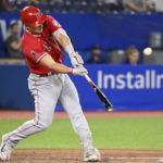 
              Los Angeles Angels' Mike Trout hits a two-run home run, also scoring David Fletcher, off Toronto Blue Jays relief pitcher Yusei Kikuchi during seventh-inning baseball game action in Toronto, Friday, Aug. 26, 2022. (Jon Blacker/The Canadian Press via AP)
            