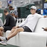 
              New York Jets quarterback Zach Wilson sits on the bench during practice before a preseason NFL football game against the New York Giants, Sunday, Aug. 28, 2022, in East Rutherford, N.J. (AP Photo/Adam Hunger)
            