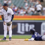 
              Tampa Bay Rays' Randy Arozarena looks to Detroit Tigers shortstop Javier Baez after being tagged out during an attempted steal in the sixth inning of a baseball game, Sunday, Aug. 7, 2022, in Detroit. (AP Photo/Carlos Osorio)
            