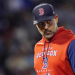 
              Boston Red Sox manager Alex Cora heads back to the dugout after pulling starting pitcher Josh Winckowski during the third inning of a baseball game against the Toronto Blue Jays, Tuesday, Aug. 23, 2022, in Boston. (AP Photo/Charles Krupa)
            