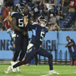 
              Tennessee Titans quarterback Logan Woodside (5) spikes the ball after scoring a touchdown on a 9-yard run against the Arizona Cardinals in the second half of a preseason NFL football game Saturday, Aug. 27, 2022, in Nashville, Tenn. (AP Photo/John Amis)
            