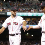 
              Boston Red Sox pitcher Michael Wacha, left, congratulates teammate Rafael Devers, right, as they walk off the field after Devers made a diving stop against the New York Yankees to save a run during the fifth inning of a baseball game at Fenway Park, Sunday, Aug. 14, 2022, in Boston. (AP Photo/Paul Connors)
            